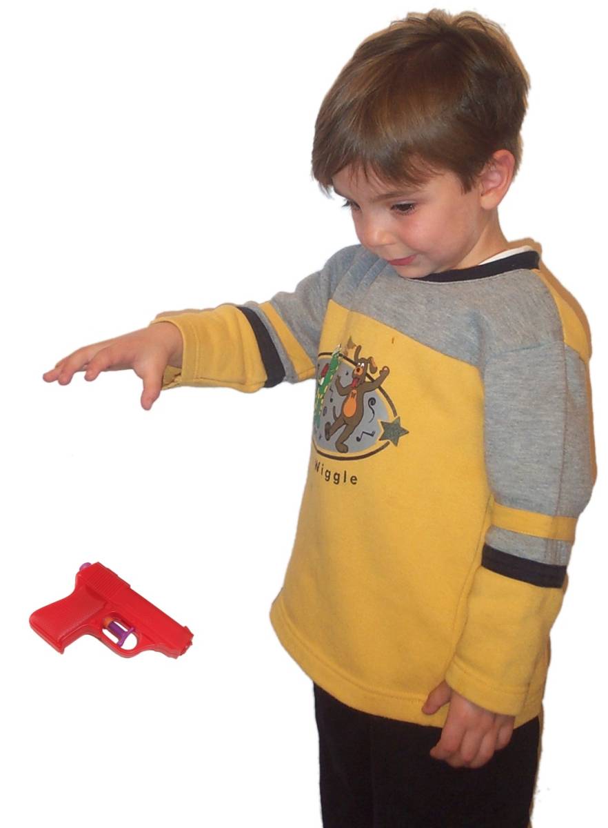 Boy dropping water pistol.jpg